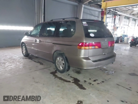 2003 Honda Odyssey EX-L with VIN 5FNRL18923B117592, listed as a IAAI auction lot 41546119 with 212,755 mi miles and . Bid and sale history available at DreamBid. Image 3.