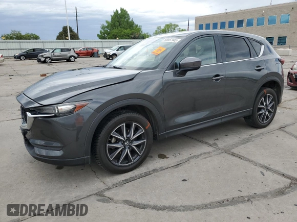2018 Mazda CX-5 Touring z VIN JM3KFBCM4J0349687, wystawiony jako Copart lot #55857945 z przebiegiem Nie podano mil oraz Szkoda całkowita • Salvage title. Historia ofert i sprzedaży dostępna na DreamBid. Obrazek 1.