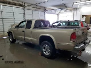 2003 Dodge Dakota SLT z VIN 1D7HL42N63S132141, wystawiony jako Copart lot #56138235 z przebiegiem 219 246 mil mil oraz Szkoda całkowita • Salvage title. Historia ofert i sprzedaży dostępna na DreamBid. Obrazek 2.