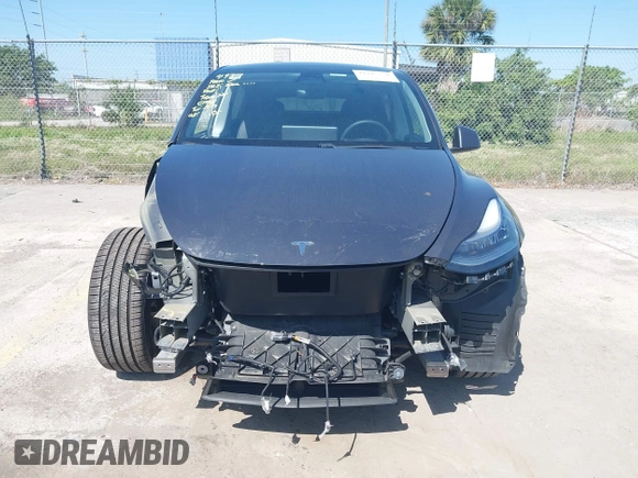 2021 Tesla Model Y Long Range with VIN 5YJYGDEE4MF076791, listed as a IAAI auction lot 41945750 with Not Provided miles and . Bid and sale history available at DreamBid. Image 6.