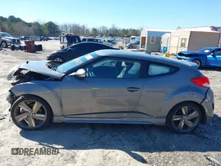 2015 Hyundai Veloster Turbo with VIN KMHTC6AE8FU229198, listed as a IAAI auction lot 41596345 with 74,943 mi miles. Bid and sale history available at carsss.com. Image 14.