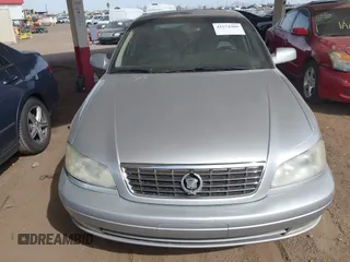 2001 Cadillac Catera z VIN W06VR54R51R058055, wystawiony jako IAAI lot #41574366 z przebiegiem 141 543 mil mil oraz . Historia ofert i sprzedaży dostępna na DreamBid. Obrazek 6.