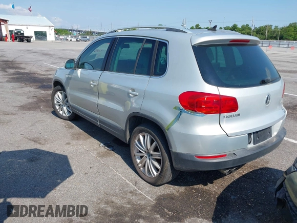 2012 Volkswagen Tiguan SE with VIN WVGAV7AX9CW581957, listed as a IAAI auction lot 42407148 with 135,553 mi miles and . Bid and sale history available at DreamBid. Image 3.