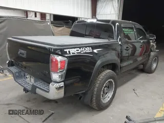 2021 Toyota Tacoma SR with VIN 3TMCZ5AN4MM448304, listed as a IAAI auction lot 42046932 with 56,161 mi miles and . Bid and sale history available at DreamBid. Image 4.