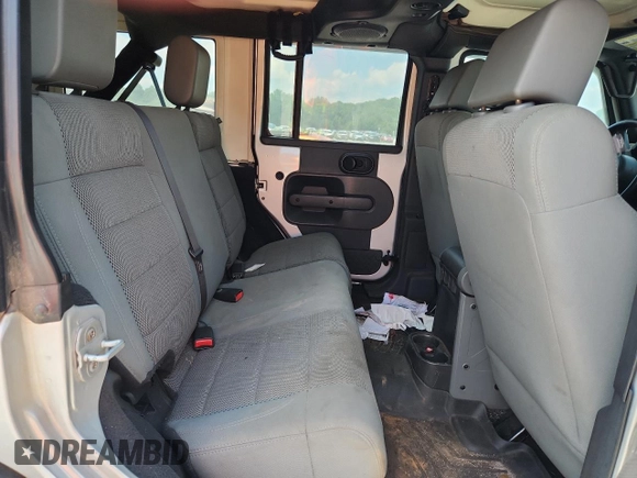 2007 Jeep Wrangler Unlimited Sahara с VIN 1J4GA59167L183198, выставлен на аукционе Copart как лот 62135995 с пробегом Не указан миль и Списание • Salvage title. История ставок и продаж доступна на DreamBid. Изображение 10.