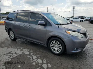 2014 Toyota Sienna XLE with VIN 5TDYK3DC6ES456558, listed as a Copart auction lot 63106085 with 231,260 mi miles and Salvage title. Bid and sale history available at DreamBid. Image 4.