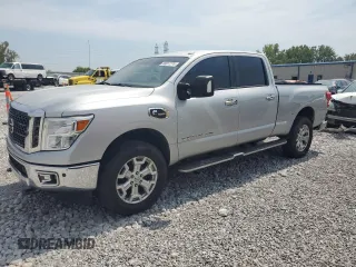 2016 Nissan Titan XD Platinum Reserve with VIN 1N6BA1F45GN514023, listed as a Copart auction lot 68817774 with 207,822 mi miles and Salvage Title. Bid and sale history available at carsss.com. Image 1.