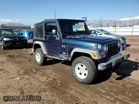 2003 Jeep Wrangler X with VIN 1J4FA39S43P338732, listed as a Copart auction lot 56315495 with 135,480 mi miles and Salvage title. Bid and sale history available at DreamBid. Image 13.