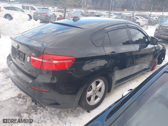 2011 BMW X6 M with VIN 5YMGZ0C57BLK14388, listed as a IAAI auction lot 41411854 with 129,248 mi miles. Bid and sale history available at carsss.com. Image 4.