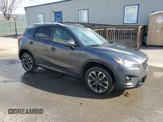 2016 Mazda CX-5 Grand Touring with VIN JM3KE4DY0G0679190, listed as a Copart auction lot 53619495 with 154,649 mi miles and Salvage Title. Bid and sale history available at carsss.com. Image 4.