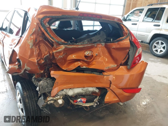 2015 Hyundai Accent GS with VIN KMHCT5AE6FU211955, listed as a IAAI auction lot 41610857 with 106,497 mi miles. Bid and sale history available at carsss.com. Image 6.