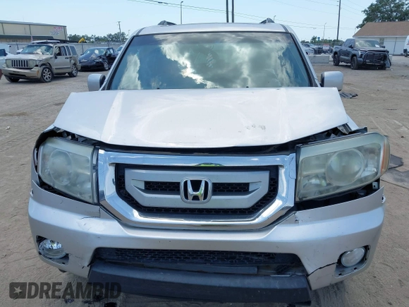 2011 Honda Pilot EX-L with VIN 5FNYF4H54BB099550, listed as a IAAI auction lot 42107327 with 217,050 mi miles and . Bid and sale history available at carsss.com. Image 6.