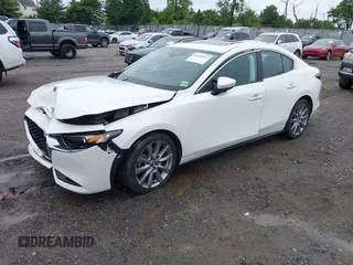 2021 Mazda 3 Preferred z VIN 3MZBPBCL0MM250862, wystawiony jako IAAI lot #42318612 z przebiegiem 86 056 mil mil oraz . Historia ofert i sprzedaży dostępna na DreamBid. Obrazek 2.