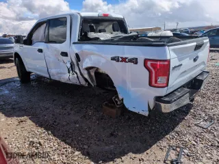 2015 Ford F-150 XLT with VIN 1FTEW1EF5FFB17148, listed as a Copart auction lot 51265215 with 128,011 mi miles and Salvage Title. Bid and sale history available at carsss.com. Image 2.