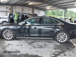 2012 Audi A8 with VIN WAUAVAFD9CN006499, listed as a IAAI auction lot 42461402 with 57,232 mi miles and . Bid and sale history available at DreamBid. Image 14.