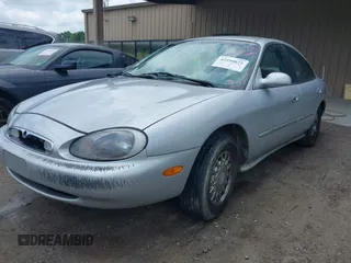 1997 Mercury Sable LS z VIN 1MELM53S5VA661602, wystawiony jako IAAI lot #42210072 z przebiegiem 106 344 mil mil oraz . Historia ofert i sprzedaży dostępna na DreamBid. Obrazek 2.