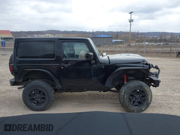 2014 Jeep Wrangler Sahara with VIN 1C4AJWBG9EL311477, listed as a IAAI auction lot 41884255 with 82,221 mi miles and . Bid and sale history available at carsss.com. Image 14.