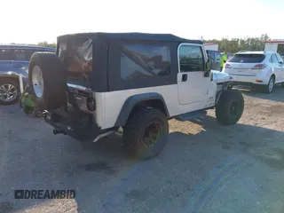 2005 Jeep Wrangler Unlimited with VIN 1J4FA44S65P335444, listed as a IAAI auction lot 41731093 with 143,918 mi miles. Bid and sale history available at carsss.com. Image 4.