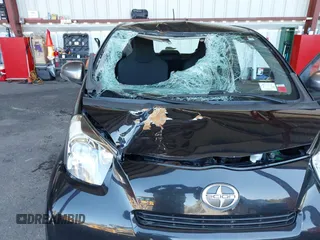 2012 Scion iQ with VIN JTNJJXB00CJ016247, listed as a IAAI auction lot 42117563 with 105,809 mi miles. Bid and sale history available at carsss.com. Image 6.