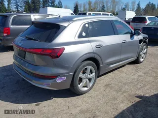 2019 Audi e-tron Premium Plus with VIN WA1LAAGE4KB012574, listed as a IAAI auction lot 41916641 with 104,911 mi miles. Bid and sale history available at carsss.com. Image 4.