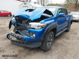 2017 Toyota Tacoma SR5 with VIN 3TMCZ5AN6HM114619, listed as a IAAI auction lot 41590012 with 165,936 mi miles. Bid and sale history available at carsss.com. Image 2.