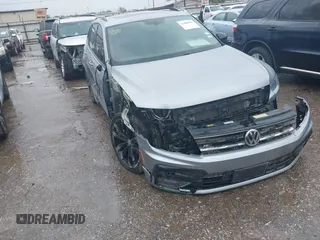 2021 Volkswagen Tiguan SE z VIN 3VV3B7AX0MM119120, wystawiony jako IAAI lot #41880563 z przebiegiem 79 932 mil mil oraz . Historia ofert i sprzedaży dostępna na DreamBid. Obrazek 1.
