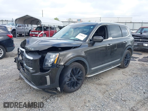 2020 Kia Telluride SX with VIN 5XYP54HC6LG077167, listed as a IAAI auction lot 41946475 with 128,319 mi miles and . Bid and sale history available at DreamBid. Image 2.
