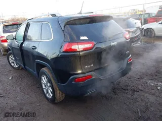 2015 Jeep Cherokee Latitude with VIN 1C4PJMCS0FW512153, listed as a IAAI auction lot 41649376 with 147,910 mi miles. Bid and sale history available at carsss.com. Image 3.