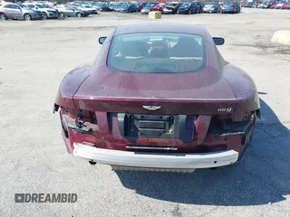 2005 Aston Martin DB9 z VIN SCFAD01A75GA01262, wystawiony jako IAAI lot #41937486 z przebiegiem 35 538 mil mil oraz . Historia ofert i sprzedaży dostępna na DreamBid. Obrazek 16.