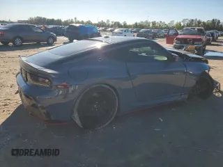 2024 Nissan Z Nismo z VIN JN1BZ4CH0RM360854, wystawiony jako Copart lot #80333234 z przebiegiem 24 237 mil mil oraz Szkody całkowita. Historia ofert i sprzedaży dostępna na DreamBid. Obrazek 3.