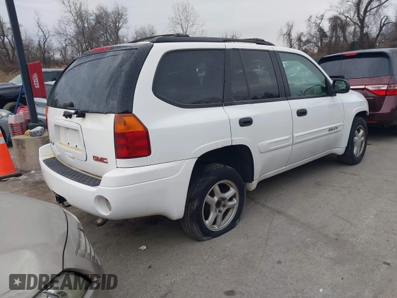 2005 GMC Envoy SLT with VIN 1GKDT13S952190876, listed as a IAAI auction lot 41308686 with 244,774 mi miles. Bid and sale history available at carsss.com. Image 4.