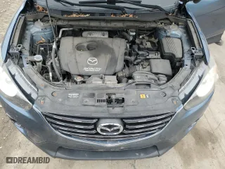 2016 Mazda CX-5 Touring with VIN JM3KE4CY9G0608152, listed as a Copart auction lot 51568775 with 142,676 mi miles and Salvage Title. Bid and sale history available at carsss.com. Image 12.