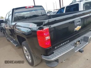 2014 Chevrolet Silverado 1500 LT with VIN 1GCVKREC5EZ325771, listed as a IAAI auction lot 41691858 with 123,475 mi miles and . Bid and sale history available at DreamBid. Image 3.