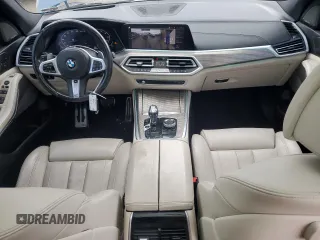 2020 BMW X5 M50i with VIN 5UXJU4C07LLE46002, listed as a Copart auction lot 77853984 with 74,098 mi miles and Salvage Title. Bid and sale history available at DreamBid. Image 8.