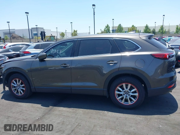 2017 Mazda CX-9 Touring with VIN JM3TCBCY1H0131233, listed as a IAAI auction lot 42490137 with 84,216 mi miles and . Bid and sale history available at DreamBid. Image 14.