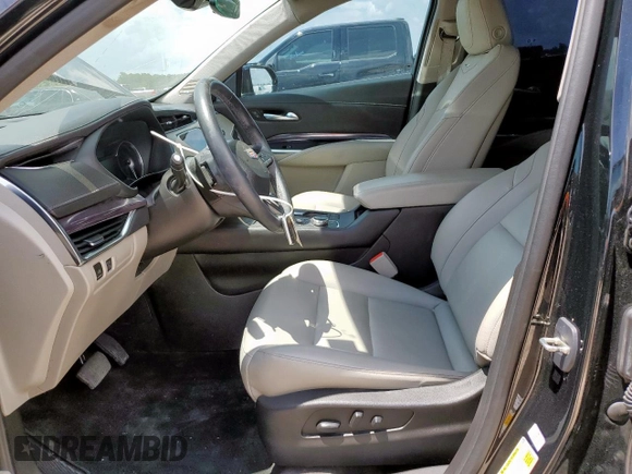 2023 Cadillac XT4 FWD Luxury with VIN 1GYAZAR46PF178003, listed as a Copart auction lot 59121545 with 42,000 mi miles and Salvage title. Bid and sale history available at DreamBid. Image 7.