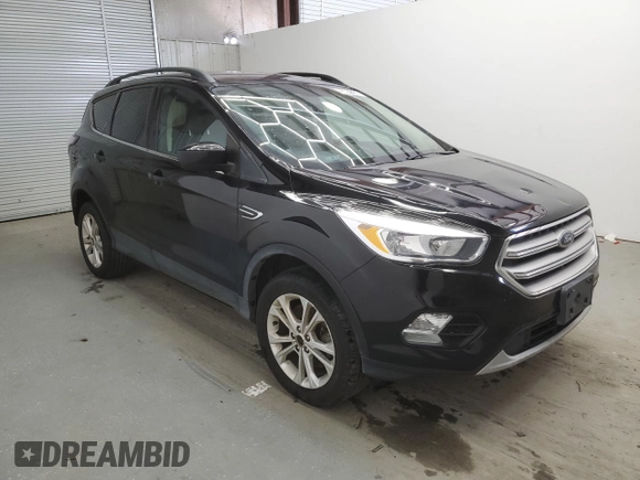 2018 Ford Escape SE z VIN 1FMCU9GD9JUD21474, wystawiony jako Copart lot #53921535 z przebiegiem 136 819 mil mil oraz Czysty tytuł • Clean title. Historia ofert i sprzedaży dostępna na DreamBid. Obrazek 4.