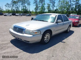 2007 Mercury Grand Marquis GS with VIN 2MEFM74VX7X616232, listed as a IAAI auction lot 42043452 with 331,491 mi miles. Bid and sale history available at carsss.com. Image 2.