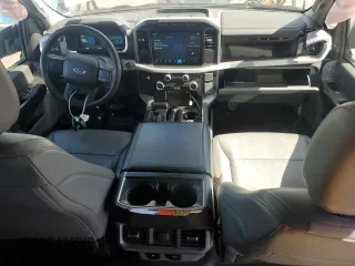 2023 Ford F-150 Lightning Pro с VIN 1FTVW1EL2PWG13712, выставлен на аукционе Copart как лот 56950955 с пробегом 60 605 миль миль и Списание • Salvage title. История ставок и продаж доступна на DreamBid. Изображение 8.