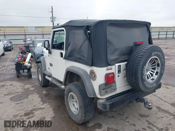 2005 Jeep Wrangler Sport with VIN 1J4FA49S25P320240, listed as a IAAI auction lot 41433371 with 144,552 mi miles. Bid and sale history available at carsss.com. Image 3.