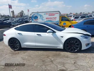 2016 Tesla Model S 90D with VIN 5YJSA1E27GF153525, listed as a IAAI auction lot 41539221 with 145,771 mi miles and . Bid and sale history available at DreamBid. Image 13.