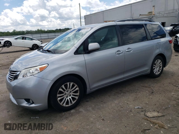 2015 Toyota Sienna XLE with VIN 5TDYK3DC0FS592251, listed as a Copart auction lot 60126165 with 118,925 mi miles and Salvage title. Bid and sale history available at DreamBid. Image 1.