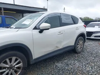 2015 Mazda CX-5 Touring with VIN JM3KE2CY4F0436664, listed as a IAAI auction lot 41876238 with 374,305 mi miles. Bid and sale history available at carsss.com. Image 6.