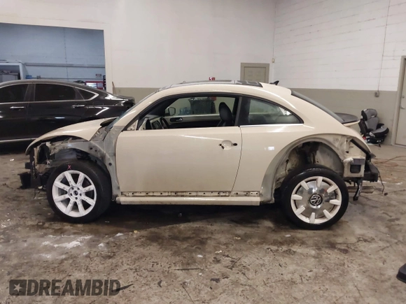 2019 Volkswagen Beetle S with VIN 3VWFD7ATXKM705322, listed as a IAAI auction lot 41409600 with 97,479 mi miles. Bid and sale history available at carsss.com. Image 15.