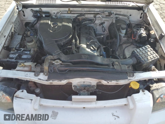 2004 Nissan Frontier XE z VIN 1N6DD26T24C456599, wystawiony jako Copart lot #55990875 z przebiegiem 197 906 mil mil oraz Szkoda całkowita • Salvage title. Historia ofert i sprzedaży dostępna na DreamBid. Obrazek 11.