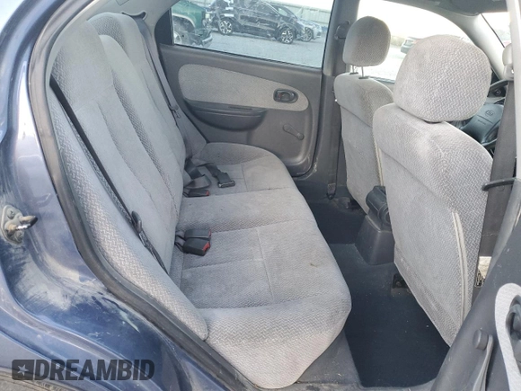 2003 Kia Spectra z VIN KNAFB121435232105, wystawiony jako Copart lot #88780695 z przebiegiem 161 466 mil mil oraz Szkoda całkowita • Salvage title. Historia ofert i sprzedaży dostępna na DreamBid. Obrazek 11.