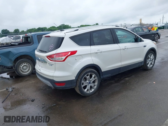 2016 Ford Escape Titanium with VIN 1FMCU9JX4GUB72080, listed as a IAAI auction lot 42519240 with 121,793 mi miles and . Bid and sale history available at DreamBid. Image 4.