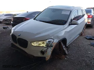 2018 BMW X1 xDrive28i with VIN WBXHT3C32J5K29627, listed as a IAAI auction lot 40995212 with 64,162 mi miles. Bid and sale history available at carsss.com. Image 2.