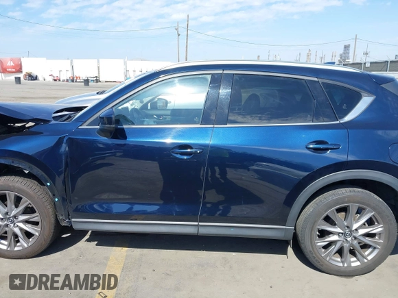 2020 Mazda CX-5 Grand Touring with VIN JM3KFADM6L1830093, listed as a IAAI auction lot 41699672 with 66,769 mi miles. Bid and sale history available at carsss.com. Image 15.