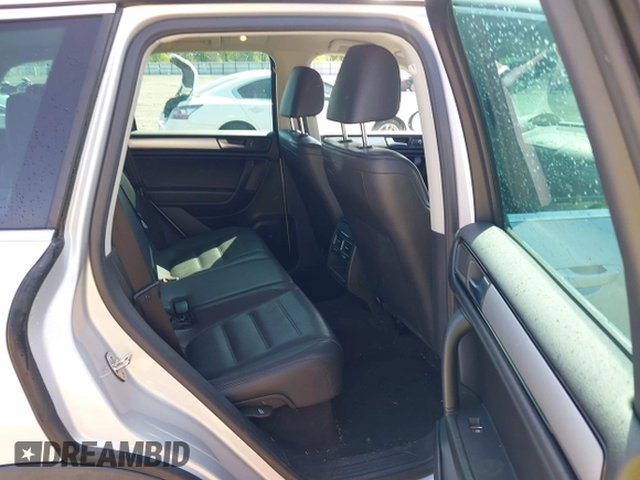 2014 Volkswagen Touareg Sport with VIN WVGEF9BP6ED007436, listed as a IAAI auction lot 41953307 with 114,925 mi miles and . Bid and sale history available at DreamBid. Image 8.